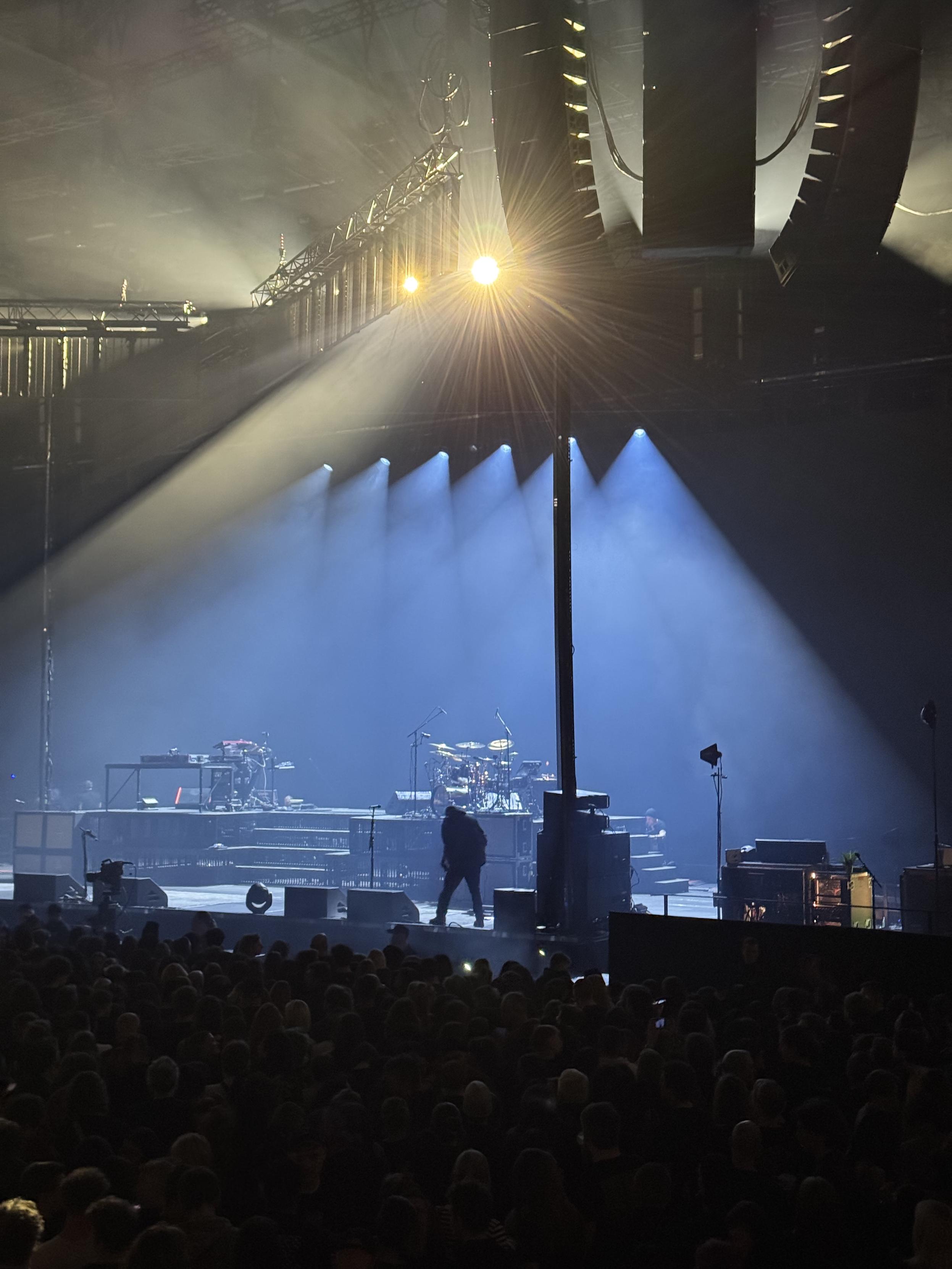 Empty music stage stage with yellow and blue spot lighting.